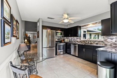 Luxury living in this impeccable End Unit Villa located on on Martin Downs Country Club in Florida - for sale on GolfHomes.com, golf home, golf lot