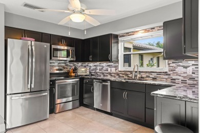 Luxury living in this impeccable End Unit Villa located on on Martin Downs Country Club in Florida - for sale on GolfHomes.com, golf home, golf lot