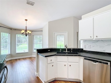 PRICE REDUCED - Energy-efficient living in a gated golf on Lake Diamond Golf and Country Club in Florida - for sale on GolfHomes.com, golf home, golf lot