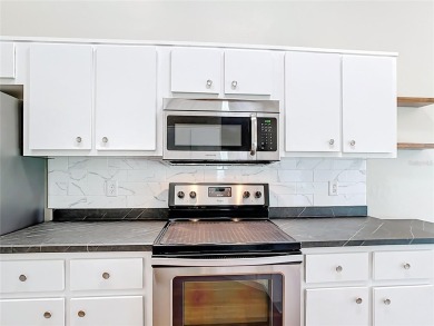 PRICE REDUCED - Energy-efficient living in a gated golf on Lake Diamond Golf and Country Club in Florida - for sale on GolfHomes.com, golf home, golf lot
