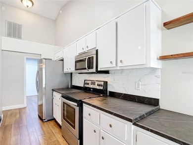 PRICE REDUCED - Energy-efficient living in a gated golf on Lake Diamond Golf and Country Club in Florida - for sale on GolfHomes.com, golf home, golf lot