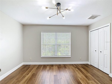 PRICE REDUCED - Energy-efficient living in a gated golf on Lake Diamond Golf and Country Club in Florida - for sale on GolfHomes.com, golf home, golf lot