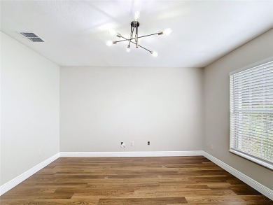 PRICE REDUCED - Energy-efficient living in a gated golf on Lake Diamond Golf and Country Club in Florida - for sale on GolfHomes.com, golf home, golf lot