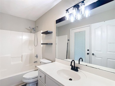 PRICE REDUCED - Energy-efficient living in a gated golf on Lake Diamond Golf and Country Club in Florida - for sale on GolfHomes.com, golf home, golf lot