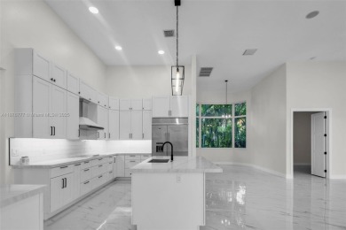 Complete modern remodeling. New Roof with 3 solar fans, Full on Heron Bay Golf Club in Florida - for sale on GolfHomes.com, golf home, golf lot