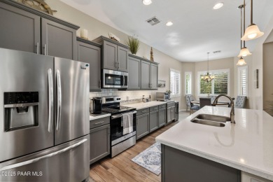 Step into this immaculately maintained 2-bedroom, 2-bathroom on Quail Wood Greens Golf Course in Arizona - for sale on GolfHomes.com, golf home, golf lot