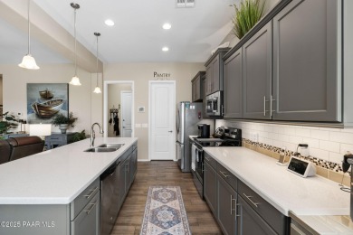 Step into this immaculately maintained 2-bedroom, 2-bathroom on Quail Wood Greens Golf Course in Arizona - for sale on GolfHomes.com, golf home, golf lot