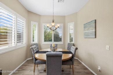 Step into this immaculately maintained 2-bedroom, 2-bathroom on Quail Wood Greens Golf Course in Arizona - for sale on GolfHomes.com, golf home, golf lot