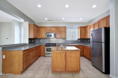 This beautiful 1,926 sq ft home is nestled on tree-lined streets on Verrado Golf Club  in Arizona - for sale on GolfHomes.com, golf home, golf lot