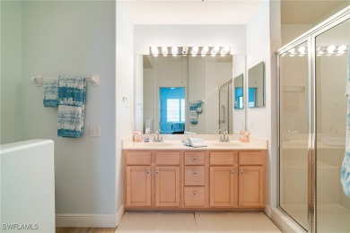Step through the screened entry to luxury vinyl tile plank on Lexington Country Club in Florida - for sale on GolfHomes.com, golf home, golf lot