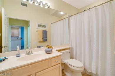 Step through the screened entry to luxury vinyl tile plank on Lexington Country Club in Florida - for sale on GolfHomes.com, golf home, golf lot