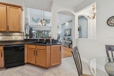 Step into a lifestyle of ease and elegance in this meticulously on Largo Golf Course in Florida - for sale on GolfHomes.com, golf home, golf lot