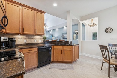 Step into a lifestyle of ease and elegance in this meticulously on Largo Golf Course in Florida - for sale on GolfHomes.com, golf home, golf lot