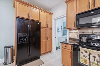 Step into a lifestyle of ease and elegance in this meticulously on Largo Golf Course in Florida - for sale on GolfHomes.com, golf home, golf lot