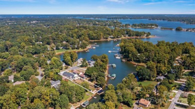 Waterfront custom home w/ one-of-a-kind architecture is a must on Westport Golf Club in North Carolina - for sale on GolfHomes.com, golf home, golf lot