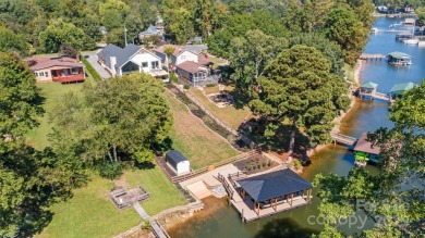 Waterfront custom home w/ one-of-a-kind architecture is a must on Westport Golf Club in North Carolina - for sale on GolfHomes.com, golf home, golf lot