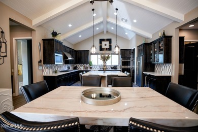 This stunning home has everything! Resort-style pool & spa plus on Verrado Golf Club - Victory in Arizona - for sale on GolfHomes.com, golf home, golf lot