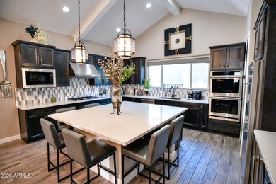 This stunning home has everything! Resort-style pool & spa plus on Verrado Golf Club - Victory in Arizona - for sale on GolfHomes.com, golf home, golf lot