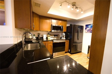 WHY RENT WHEN YOU CAN OWN THIS 2/2 CONDO WITH ALMOST 1,100 SQ on Woodlands Country Club in Florida - for sale on GolfHomes.com, golf home, golf lot