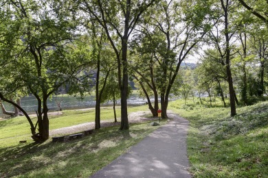 LAKEFRONT, LAKEFRONT, LAKEFRONT! This fully furnished, turnkey on Pointe Royale Village Country Club in Missouri - for sale on GolfHomes.com, golf home, golf lot