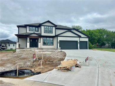 Big and beautiful Niko plan by Prieb Homes is situated next to on Shawnee Golf and Country Club in Kansas - for sale on GolfHomes.com, golf home, golf lot