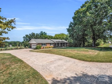 Located on Hole 15 of Riverbend Golf Course, this beautiful home on River Bend YMCA Golf Course in North Carolina - for sale on GolfHomes.com, golf home, golf lot