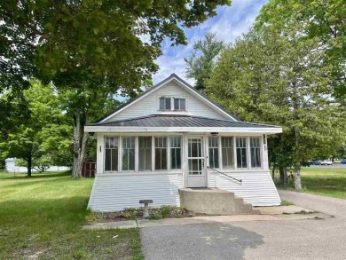 Cottage style home on Residential / Commercial lot. Located next on Charlevoix Golf Club in Michigan - for sale on GolfHomes.com, golf home, golf lot