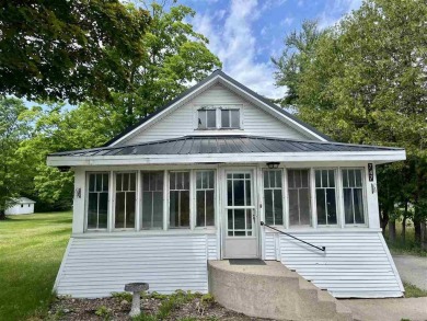 Cottage style home on Residential / Commercial lot. Located next on Charlevoix Golf Club in Michigan - for sale on GolfHomes.com, golf home, golf lot