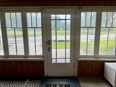 Cottage style home on Residential / Commercial lot. Located next on Charlevoix Golf Club in Michigan - for sale on GolfHomes.com, golf home, golf lot