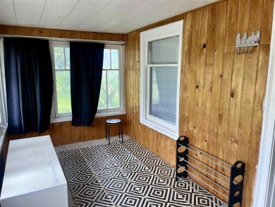 Cottage style home on Residential / Commercial lot. Located next on Charlevoix Golf Club in Michigan - for sale on GolfHomes.com, golf home, golf lot