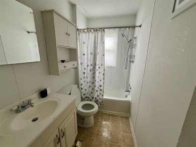 Cottage style home on Residential / Commercial lot. Located next on Charlevoix Golf Club in Michigan - for sale on GolfHomes.com, golf home, golf lot