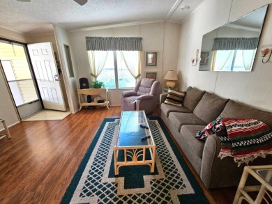 This home is located on leased land in a 55+ resort-style MH on Big Cypress Golf and Country Club in Florida - for sale on GolfHomes.com, golf home, golf lot