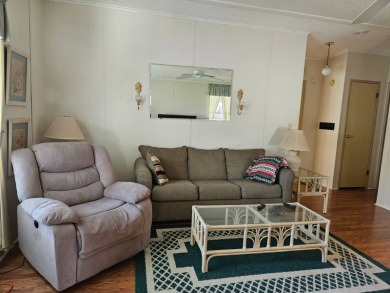 This home is located on leased land in a 55+ resort-style MH on Big Cypress Golf and Country Club in Florida - for sale on GolfHomes.com, golf home, golf lot