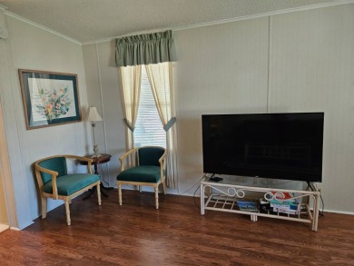 This home is located on leased land in a 55+ resort-style MH on Big Cypress Golf and Country Club in Florida - for sale on GolfHomes.com, golf home, golf lot