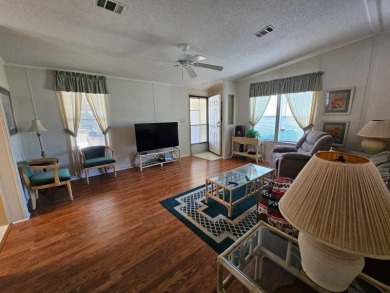 This home is located on leased land in a 55+ resort-style MH on Big Cypress Golf and Country Club in Florida - for sale on GolfHomes.com, golf home, golf lot