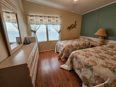 This home is located on leased land in a 55+ resort-style MH on Big Cypress Golf and Country Club in Florida - for sale on GolfHomes.com, golf home, golf lot