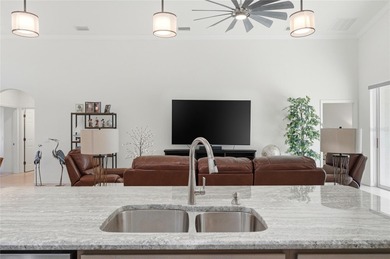 Experience effortless Florida living in this modern and on Lake Ashton Golf Club in Florida - for sale on GolfHomes.com, golf home, golf lot