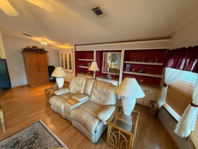 This well-cared for home is being sold furnished.  It is located on Del Tura Golf and Country Club in Florida - for sale on GolfHomes.com, golf home, golf lot