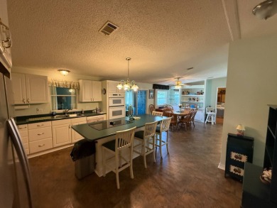 This well-cared for home is being sold furnished.  It is located on Del Tura Golf and Country Club in Florida - for sale on GolfHomes.com, golf home, golf lot