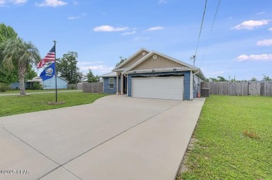 Beautiful corner lot home in Lynn Haven with detached on Panama Country Club in Florida - for sale on GolfHomes.com, golf home, golf lot