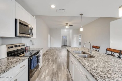 Beautiful corner lot home in Lynn Haven with detached on Panama Country Club in Florida - for sale on GolfHomes.com, golf home, golf lot