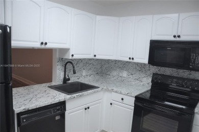 Experience serenity in this stunning 1-bedroom, 1-bathroom on Jacaranda Golf Club in Florida - for sale on GolfHomes.com, golf home, golf lot