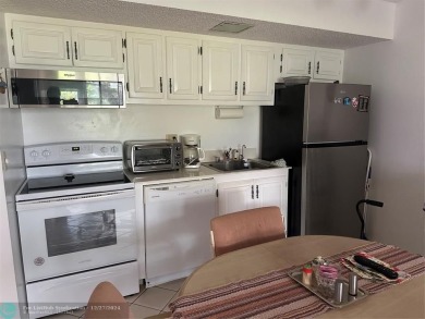 Beautiful unit 1/1 in Wynmoor 55+ won't last. First floor easy on Wynmoor Golf Course in Florida - for sale on GolfHomes.com, golf home, golf lot