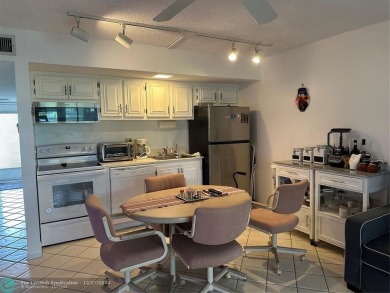 Beautiful unit 1/1 in Wynmoor 55+ won't last. First floor easy on Wynmoor Golf Course in Florida - for sale on GolfHomes.com, golf home, golf lot