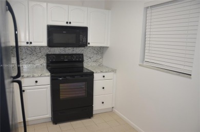 Experience serenity in this stunning 1-bedroom, 1-bathroom on Jacaranda Golf Club in Florida - for sale on GolfHomes.com, golf home, golf lot