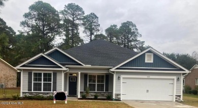 This stunning, never-before-lived-in model home is now available on Harbour Point Golf Club in North Carolina - for sale on GolfHomes.com, golf home, golf lot