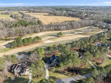 This exceptional home offers luxury living in one of the on Hasentree Club in North Carolina - for sale on GolfHomes.com, golf home, golf lot