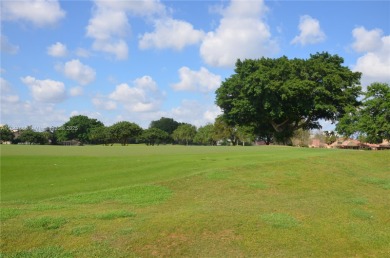 Experience serenity in this stunning 1-bedroom, 1-bathroom on Jacaranda Golf Club in Florida - for sale on GolfHomes.com, golf home, golf lot
