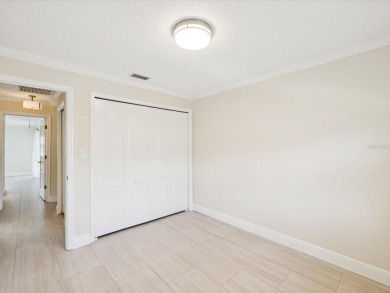 Welcome to this stunning, fully renovated 4 bedroom, 2 bathroom on East Lake Woodlands Country Club in Florida - for sale on GolfHomes.com, golf home, golf lot