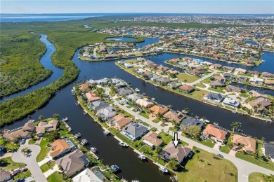 Luxury waterfront living awaits in this custom residence located on Twin Isles Country Club in Florida - for sale on GolfHomes.com, golf home, golf lot